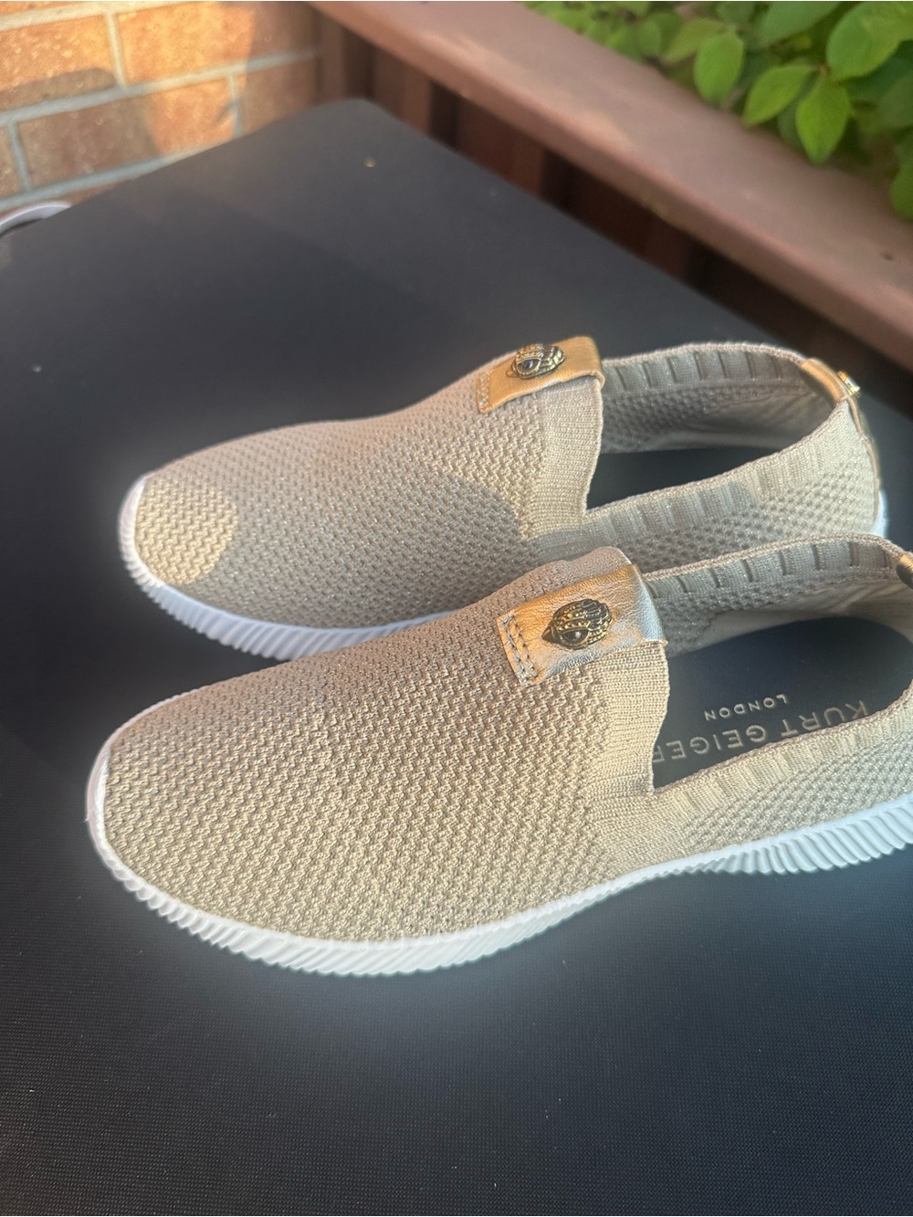 Kurt Geiger  Taupe Slip-On Knit Sneakers with White Sole and Gold Badge
